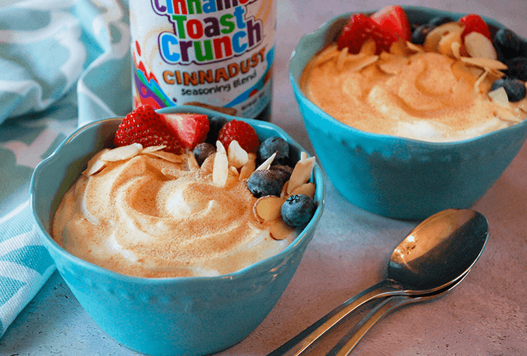 2 Cinnadust™ Fruit, Nut & Yogurt Bowls with a jar of Cinnadust™ between them.